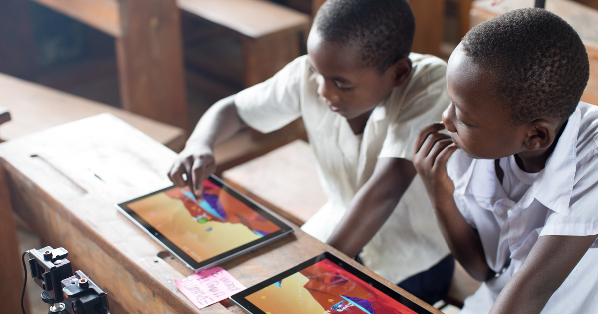 Children learning using tablets