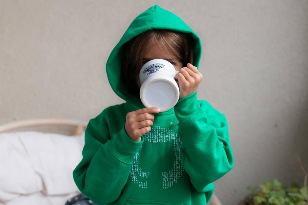 A youth model wears a green GitHub sweatshirt.