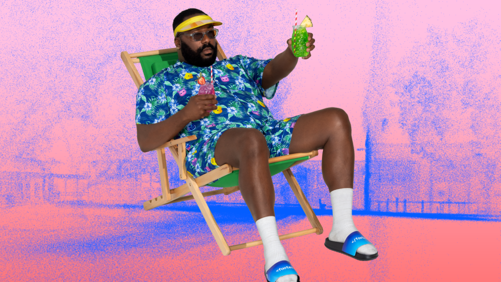 A man in a deck chair. He is wearing the cabana set - shirt and shorts with a tropical pattern and covered with Mona, Rubber Ducky and Copilot. He is wearing socks and slides on his feet. The slides say <footer>. He is holding a drink. He is on a pink background with blue dots creating the image of a park.